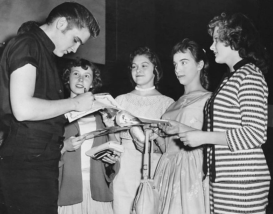 Elvis Presley signing autographs for young fans in Minneapolis in 1956