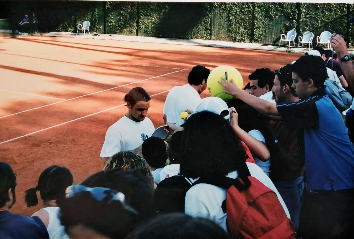 Roger Federer signing autographs for fans at the 2003 Rome Masters